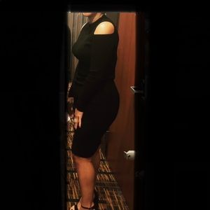 Black knit midi dress with shoulder cutouts.